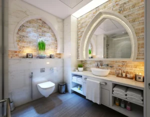 Salle de bain design avec lavabo vasque, miroir à encadrement voûté et toilettes suspendues.